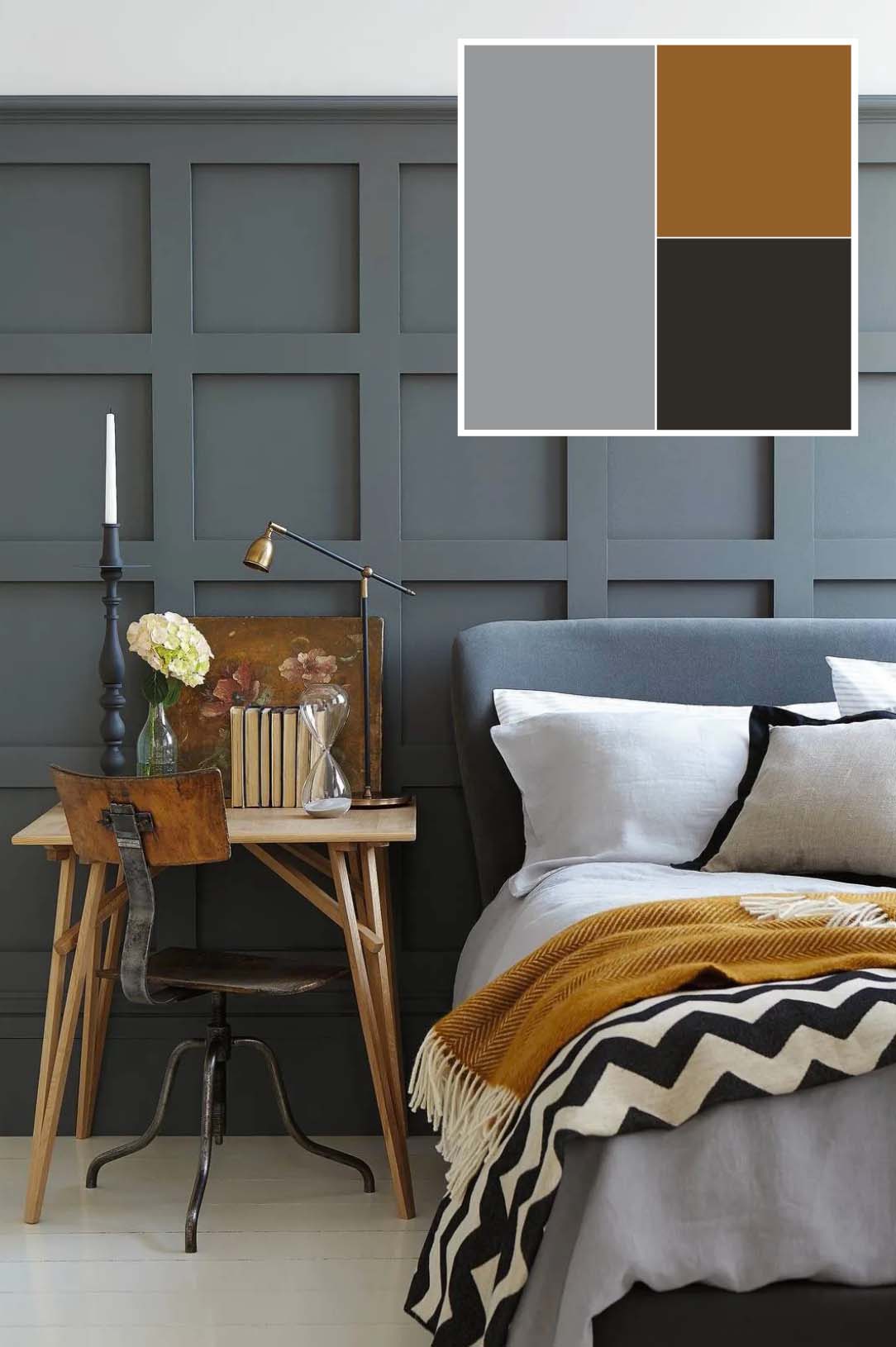 In questa camera da letto la testiera, in continuità con la boiserie lignea grigia (dipinta con Intelligent Matt Emulsion color Scree di Little Greene, www.littlegreene.com), crea un fondale moderno e avvolgente, che dà coerenza visiva e carattere all’intero ambiente. Il resto dell’arredo lavora per bilanciare questa base cromatica: la scrivania in legno chiaro introduce un dettaglio più naturale e leggero, che evita l’eccessiva monotonia del tono su tono, la sedia in metallo aggiunge un tocco vintage, il pavimento a doghe panna scalda la palette. Il corredo tessile completa la scena: le lenzuola bianche alleggeriscono e danno freschezza, mentre la coperta beige e nera aggiunge profondità cromatica. Infine il plaid senape è il dettaglio cromatico che rompe la neutralità, introducendo una nota vivace. 