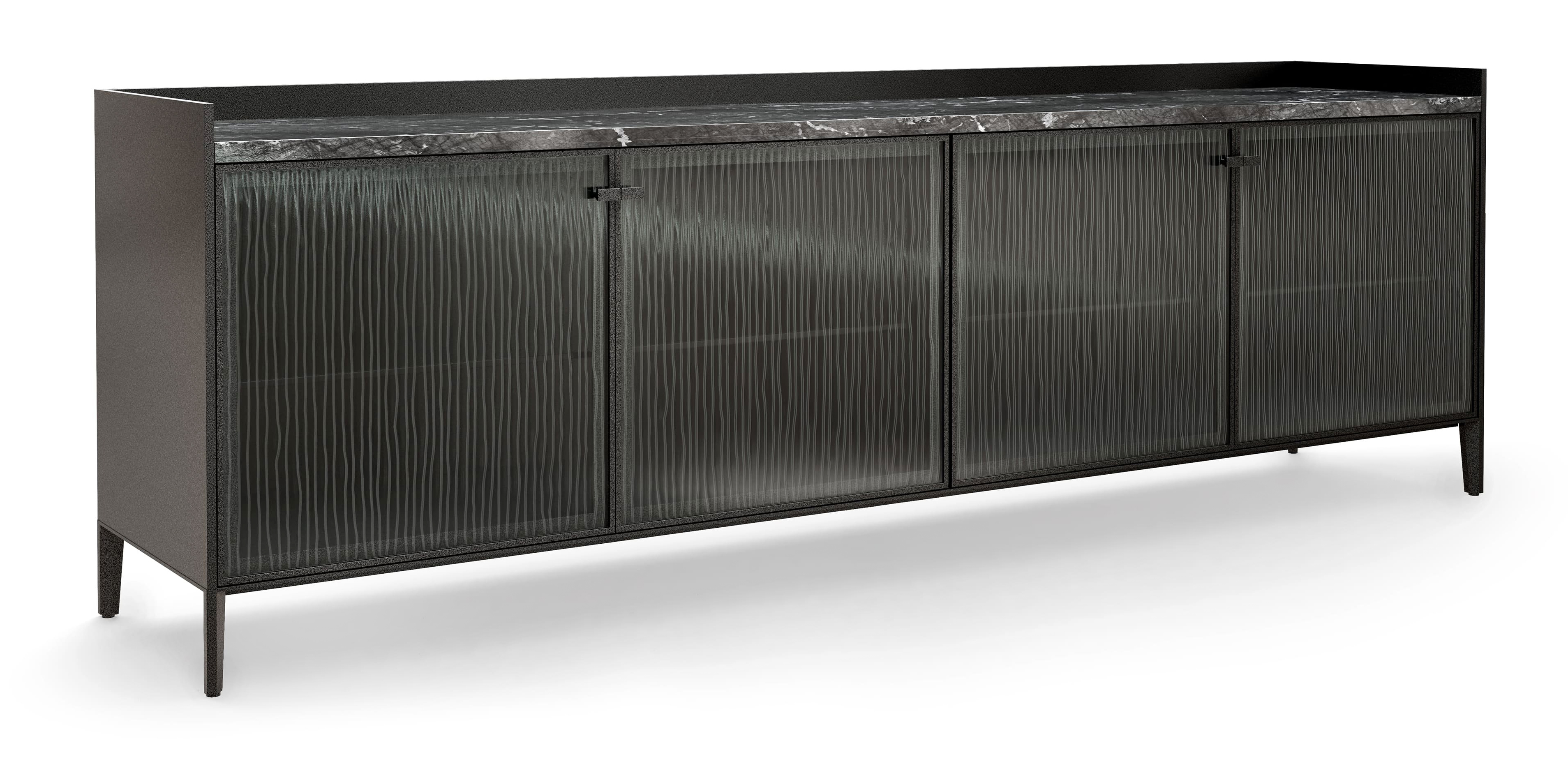 La madia Segesta di Fiam Italia ha la scocca esterna realizzata in legno laccato, le ante in vetro temperato e il il top realizzato in marmo o in legno laccato in tinta. La base e i piedini sono in acciaio verniciato Grigio Vulcano. È disponibile in tre diverse tipologie.  https://www.fiamitalia.it – Salone del mobile 2025, padiglione 09, Stand C09.