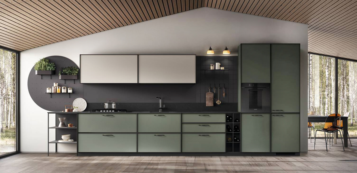 Ha uno sviluppo lineare la cucina Jeometrica di Scavolini che ha le ante delle basi e delle colonne in Decorativo Selva con maniglie orizzontali in metallo finitura Antracite in gradazione con il piano cucina in Laminato Stratificato Nero Ardesia. I due pensili a sviluppo orizzontale sono in Decorativo Soft Beige. Lo schienale attrezzato in Laminato Anise, corredato di accessori nella finitura Antracite, è coordinato con la base a giorno in Laminato Anise e elemento portabottiglie in Decorativo Anise. Prezzo su richiesta. www.scavolini.com