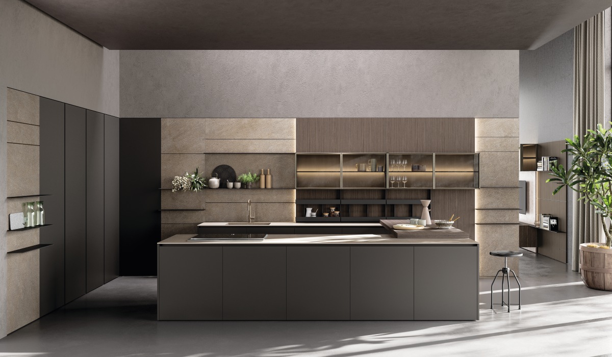 La finitura più distintiva della cucina Axis di Zampieri è il rovere carbon, una superficie elegante e profonda. Caratterizzata da una lavorazione che evidenzia la trama del legno scuro, questa finitura dona alla cucina un’estetica sofisticata e di forte impatto visivo. Axis si distingue per il suo design minimalista e architettonico, con volumi puri e linee orizzontali ben definite. Le ante, spesso senza maniglia o con profili in alluminio integrati, sottolineano la ricerca dell’essenzialità. I piani di lavoro, disponibili in materiali come la pietra naturale o il Dekton, si armonizzano con il rovere carbon, creando un equilibrio tra calore e rigore. www.zampiericucine.it La finitura più distintiva della cucina Axis di Zampieri è il rovere carbon, una superficie elegante e profonda. Caratterizzata da una lavorazione che evidenzia la trama del legno scuro, questa finitura dona alla cucina un’estetica sofisticata e di forte impatto visivo. Axis si distingue per il suo design minimalista e architettonico, con volumi puri e linee orizzontali ben definite. Le ante, spesso senza maniglia o con profili in alluminio integrati, sottolineano la ricerca dell’essenzialità. I piani di lavoro, disponibili in materiali come la pietra naturale o il Dekton, si armonizzano con il rovere carbon, creando un equilibrio tra calore e rigore. www.zampiericucine.it