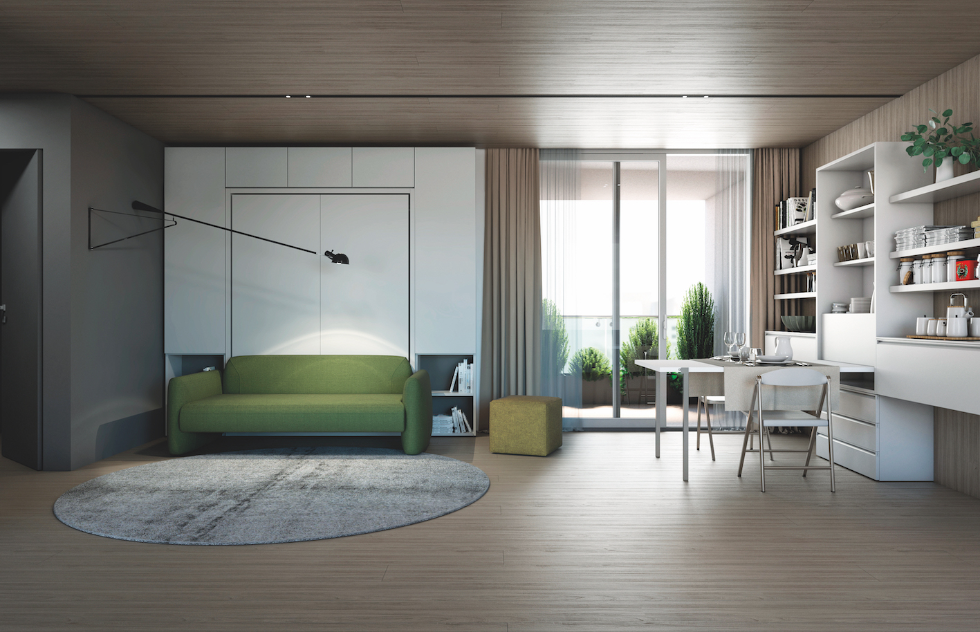 Il divano verde Minerva di Clei con sistema trasformabile in letto matrimoniale (nella versione Penelope) inserito in un'ambientazione monolocale con composizione Making Room. A destra, il tavolo Wally Maxi aperto.