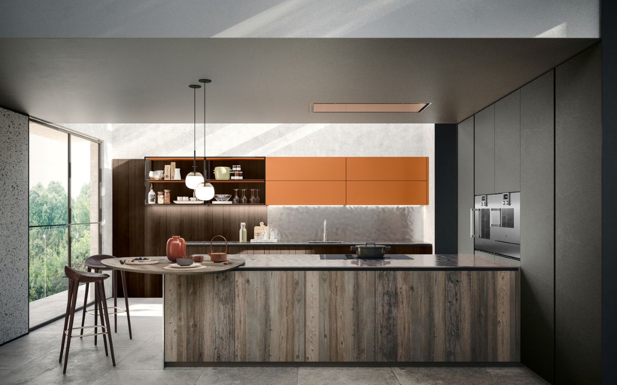 La composizione cucina con penisola di Scandola è realizzata con l’accostamento di differenti finiture e matericità. Il Noce Coke delle ante dogate è in contrapposizione con la finitura Caramello laccata opaca. L’ampia penisola è realizzata in Legno Vecchio Grey, una finitura creata dal legno recuperato dei rivestimenti delle case di montagna ripristinato, ma che mantiene tutta la sua autenticità. Il top in acciaio spazzolato è l’elemento di stacco, ma si integra perfettamente dando un tocco più moderno. Il prezzo di una base con un'anta L60 x P60 x H78 cm va da 452 a 582 euro Iva esclusa a seconda della finitura scelta. https://soluzioniarredo.scandolamobili.it/ La composizione cucina con penisola di Scandola è realizzata con l’accostamento di differenti finiture e matericità. Il Noce Coke delle ante dogate è in contrapposizione con la finitura Caramello laccata opaca. L’ampia penisola è realizzata in Legno Vecchio Grey, una finitura creata dal legno recuperato dei rivestimenti delle case di montagna ripristinato, ma che mantiene tutta la sua autenticità. Il top in acciaio spazzolato è l’elemento di stacco, ma si integra perfettamente dando un tocco più moderno. Il prezzo di una base con un'anta L60 x P60 x H78 cm va da 452 a 582 euro Iva esclusa a seconda della finitura scelta. https://soluzioniarredo.scandolamobili.it/