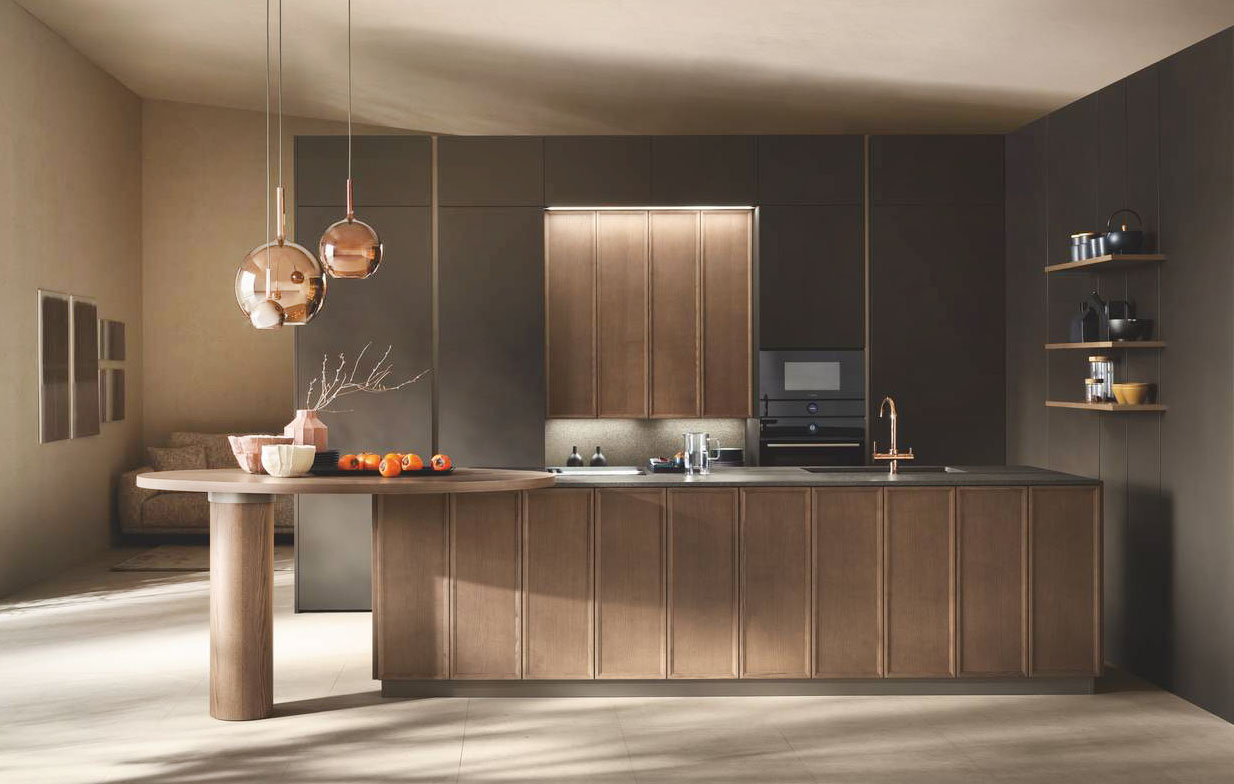La grande isola con il piano colazione ovale domina la cucina Poetica di Scavolini che è caratterizzata dalle ante in impiallacciato Frassino Pecan abbinato al piano Cosmolite Stargreen Rock Plan. Le colonne contenitive in PET Microdecor Space Black che danno vita ad un'ampia armadiatura a parete abbinata alla boiserie laterale con mensole. Prezzo su richiesta. https://www.scavolini.com La grande isola con il piano colazione ovale domina la cucina Poetica di Scavolini che è caratterizzata dalle ante in impiallacciato Frassino Pecan abbinato al piano Cosmolite Stargreen Rock Plan. Le colonne contenitive in PET Microdecor Space Black che danno vita ad un'ampia armadiatura a parete abbinata alla boiserie laterale con mensole. Prezzo su richiesta. https://www.scavolini.com