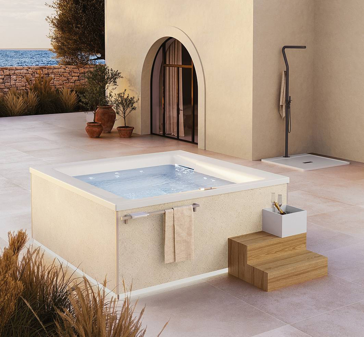 La minipiscina Gilium design Claudio Papa per Disenia, nella versione freestanding con finitura Pietra di Trani per le fiancate perimetrali e guscio interno in Bianco Lucido, è dotata di manigli one portasciugamani, portaghiaccio e scaletta Riviera in rovere. Ospita fino a quattro persone contemporaneamente, offrendo un benefico idromassaggio. Misura L 210 x P 210 x H 85 cm. Prezzo su richiesta. www.disenia.it La minipiscina Gilium design Claudio Papa per Disenia, nella versione freestanding con finitura Pietra di Trani per le fiancate perimetrali e guscio interno in Bianco Lucido, è dotata di manigli one portasciugamani, portaghiaccio e scaletta Riviera in rovere. Ospita fino a quattro persone contemporaneamente, offrendo un benefico idromassaggio. Misura L 210 x P 210 x H 85 cm. Prezzo su richiesta. www.disenia.it