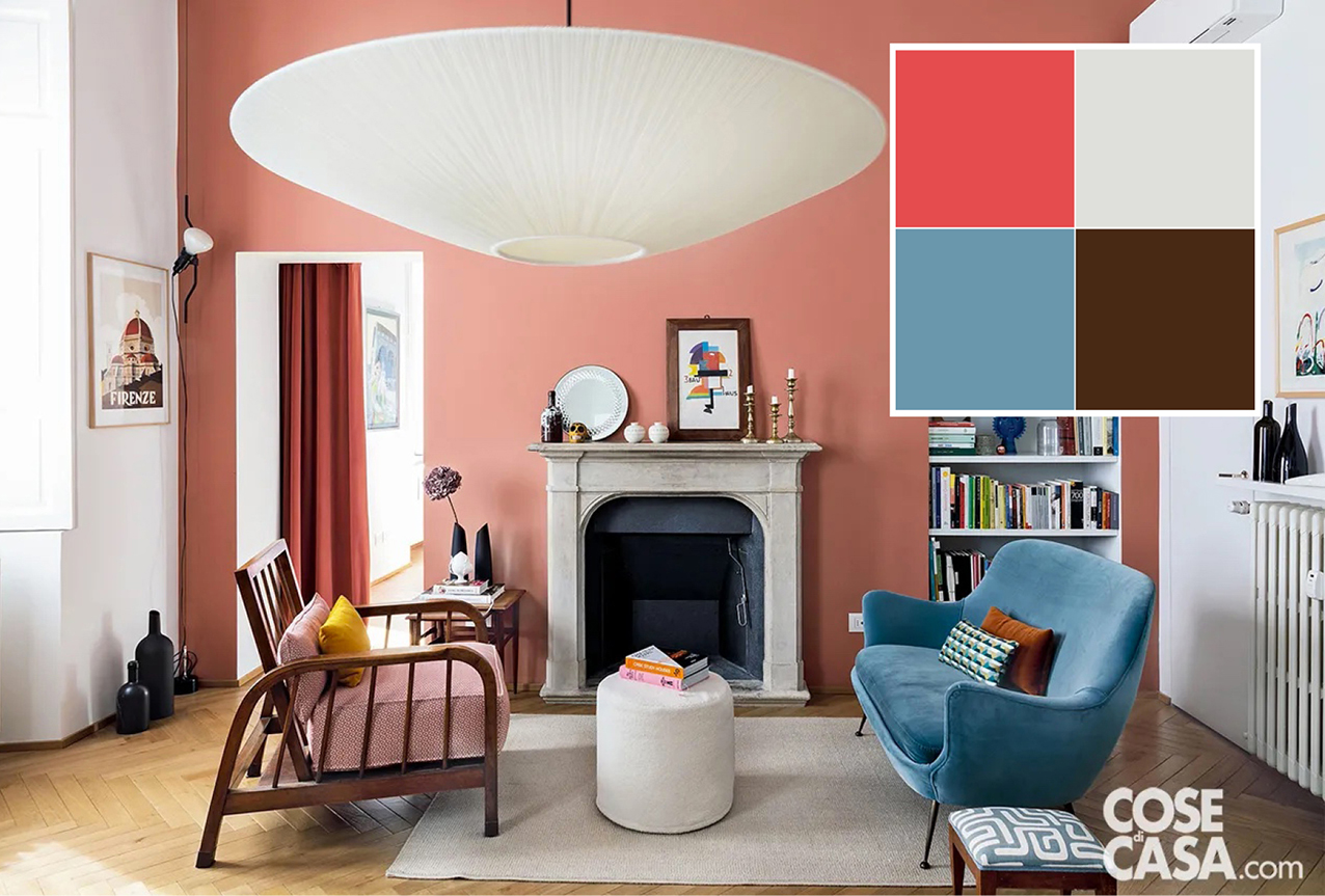 In questo soggiorno la parete di fondo della stanza è stata dipinta con idropittura rosa corallo, che trova corrispondenza anche nella tenda che scherma la porta che conduce alla zona notte. Tutto intorno il colore predominante è il bianco, che definisce le altre pareti, le porte, le nicchie, il profilo del camino e, al centro, il tappeto e il pouf.
Spiccano sul fondo corallo la poltrona con struttura in legno scuro e il rivestimento in velluto di colore azzurro del divano in stile anni '40, che creano un bel contrasto di toni e donano eleganza all'ambiente.
Progetto Arch. Guia Bartolozzi, Via Santa Marta 14, Milano a.guiabartolozzi@gmail.com - Foto: Giulio Oriani e Beatrice Vergani/Vega Mg