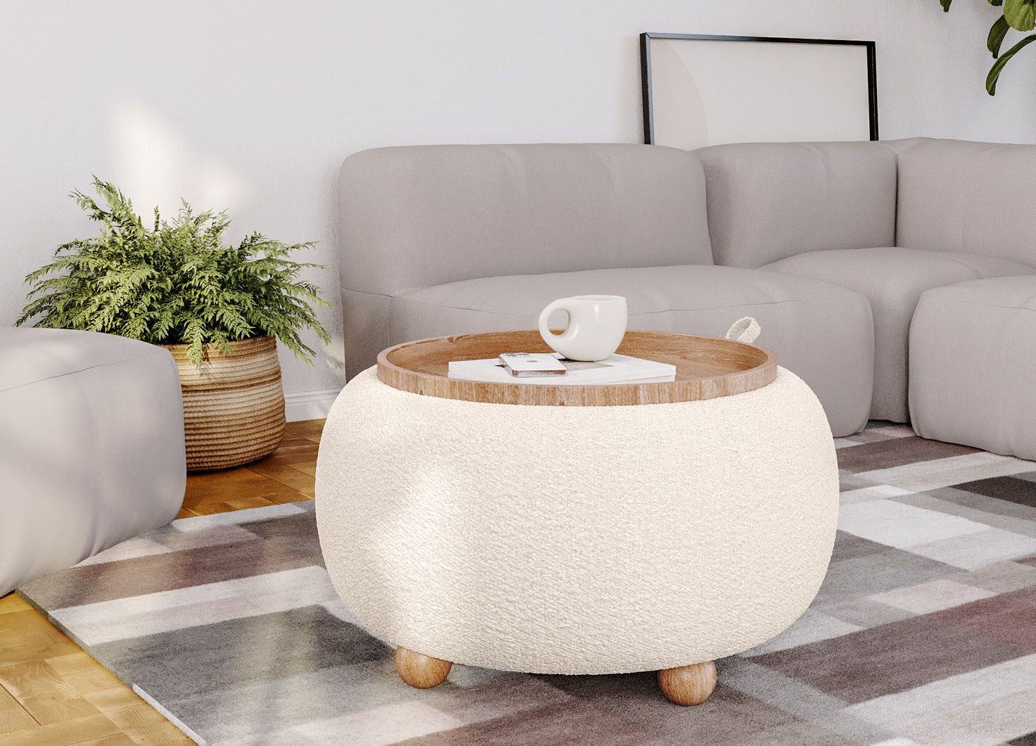 In salotto con vassoio  Il grande pouf contenitore Doze di Deghi può essere usato come seduta aggiuntiva o come tavolino basso davanti ai divani grazie alla presenza di un vassoio amovibile in legno chiaro come i piedini rotondi. La struttura in MDF è imbottita in schiuma ad alta densità e rivestita in tessuto bouclé bianco. Misura Ø 67 x H 38 cm. Prezzo 170 euro. https://www.deghi.it