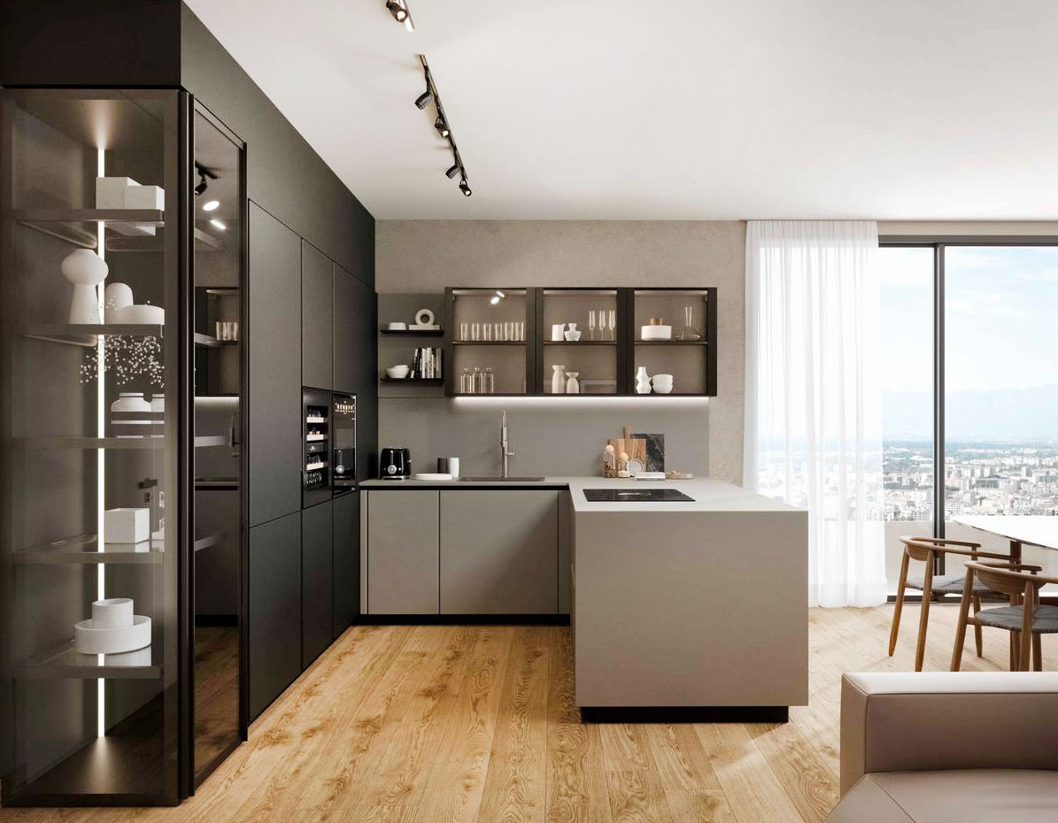 Pratica 2408 di La Casa Moderna è la composizione ad angolo che si apre completamente sulla zona giorno: la penisola con le basi in PET e il top in laminato collega la cucina con il soggiorno. È  “illuminata” da piccoli pensili  e da una colonna con anta e fianco tutti in vetro fumé. Un modulo base da 60 cm anta, apertura con gola, zoccolo, top in laminato, prezzo a partire da 305 euro. https://lacasamoderna.com