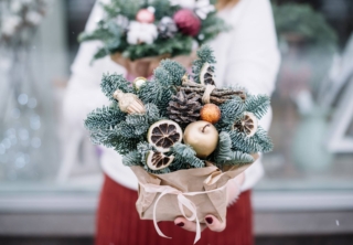 Very,Nice,Young,Woman,Holding,Big,Beautiful,Winter,Arrangement,Of