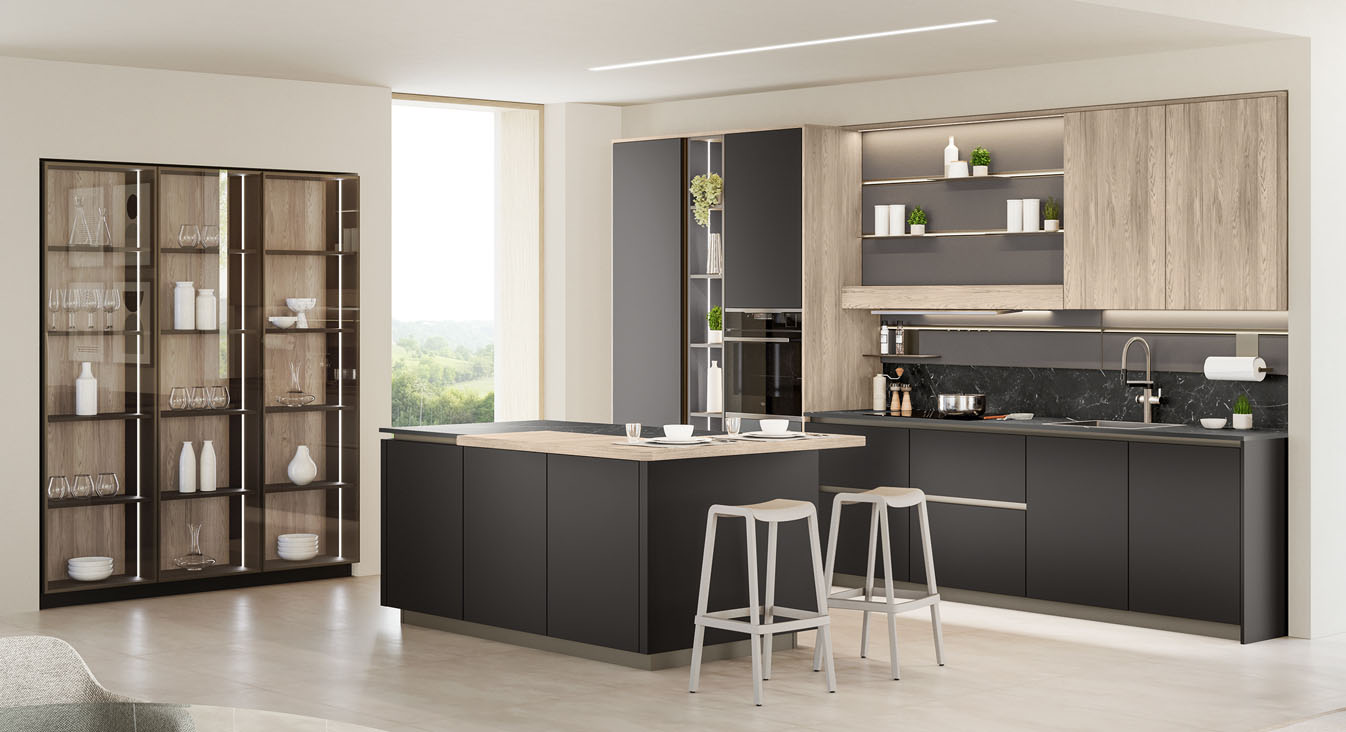 Permette di fruire simultaneamente della zona lavaggio e cottura e di quella dedicata alla consumazione la cucina Start-Time di Veneta Cucine che si sviluppa intorno all'isola centrale. Le basi hanno le ante lisce Nero Soft che mette in risalto i pensili, il bancone snack e gli schienali in Rovere Coloniale Dek. Il pannello Groove, attrezzato con mensole e luci, è funzionale alla preparazione dei cibi. Prezzo su richiesta. https://www.venetacucine.com