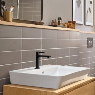 Rubinetto in appoggio nero opaco hansgrohe LivaFine con lavabo da appoggio