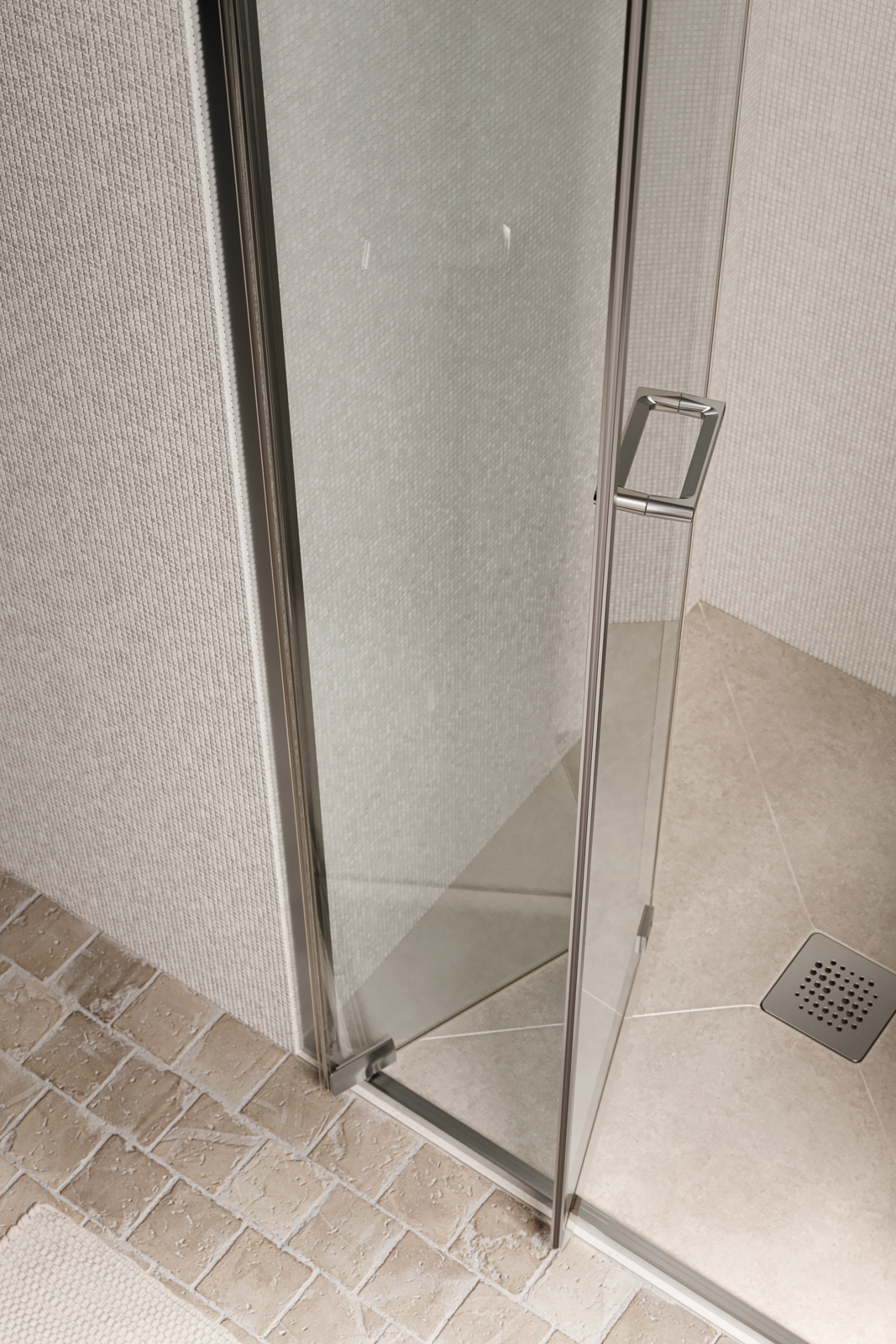 Box doccia Zefiro Light, configurazione in nicchia con porta pieghevole; profili e dettagli in Brill e vetro in finitura trasparente 6 mm. In abbinamento, piatto doccia Pegaso in Laminam da L 90 x P 80 cm.