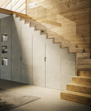 Skema Infinito di FerreroLegno - con ante trapezoidali a battente in finitura grezzo dello stesso colore della parete – è la soluzione ideale per chiudere un vano sottoscala assicurando continuità con la superfice della parete. Skema Infinito di FerreroLegno - con ante trapezoidali a battente in finitura grezzo dello stesso colore della parete – è la soluzione ideale per chiudere un vano sottoscala assicurando continuità con la superfice della parete.