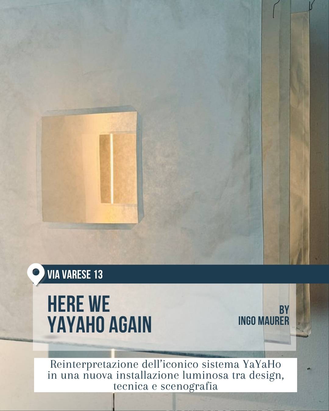 Fuorisalone 2026, Milano Design Week: installazione “Here We YaYaHo Again” in via Varese 13, by Ingo Maurer. Ambiente essenziale con pareti chiare e lampada luminosa geometrica. Il progetto reinterpreta l’iconico sistema YaYaHo in una nuova scenografia tra design della luce, tecnica e installazione.
