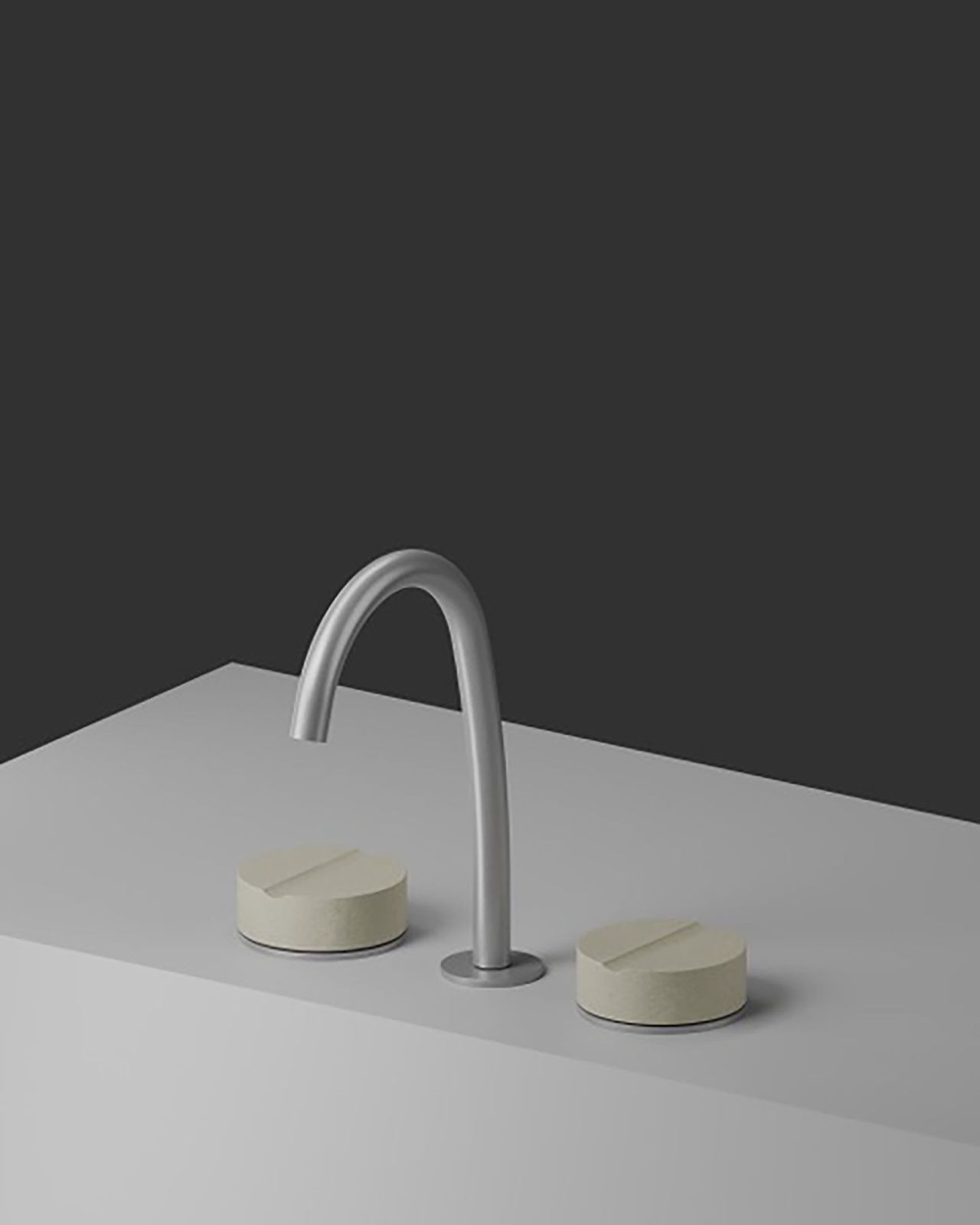 QD MAGISTRO LAB presenta con Eternal Concrete, design Gianluigi Landoni, l’evoluzione naturale di un’icona. Si tratta di una nuova interpretazione della collezione di rubinetti, in cui il cemento sostituisce il marmo. Alla purezza circolare della precedente maniglia in marmo viene sottratto un volume, uno spicchio rimosso con un taglio netto. Un passaggio che segna una trasformazione profonda estetica e soprattutto sensoriale. Non più la levigatezza fredda del marmo bensì la texture porosa del cemento. È un oggetto essenziale e solido, una materia pura che non teme il passare del tempo. Si realizza così un ritorno all'essenza, dove la solidità del cemento e la precisione del taglio si fondono in un pezzo di architettura domestica fatto per restare negli anni. www.qdrubinetterie.it – Fuorisalone, Tortona Lab Milano, via Tortona 34, Milano