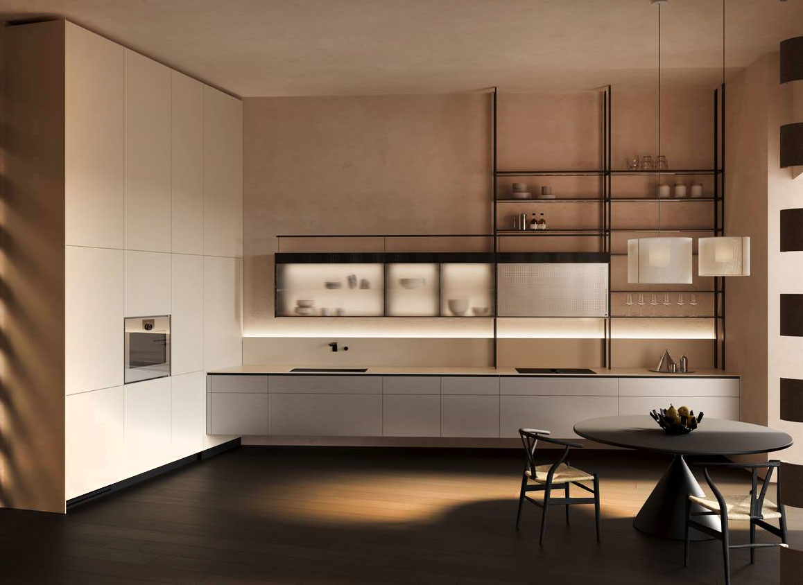 L'allestimento Crafting Forward di Valcucine costruisce un dialogo tra artigianato e tecnologia senza contrapposizioni, valorizzando collaborazioni con realtà produttive e laboratori che condividono la stessa cultura del saper fare. La ricerca si traduce in una nuova esplorazione delle finiture e delle possibilità espressive del sistema cucina: vetro, pietra e metallo vengono trattati come superfici vive, attraverso lavorazioni capaci di amplificarne profondità visiva e qualità tattile. La ricerca sui metalli trova espressione nell’introduzione, per la prima volta nel sistema cucina, di ante realizzate in vero titanio: un materiale autentico, dalla natura fortemente cangiante, la cui superficie reagisce alla luce generando riflessi e variazioni cromatiche, espressione di una nuova idea di preziosità contemporanea. https://www.valcucine.com - Fuorisalone, Valcucine Milano Brera – Corso Garibaldi 99, Milano.