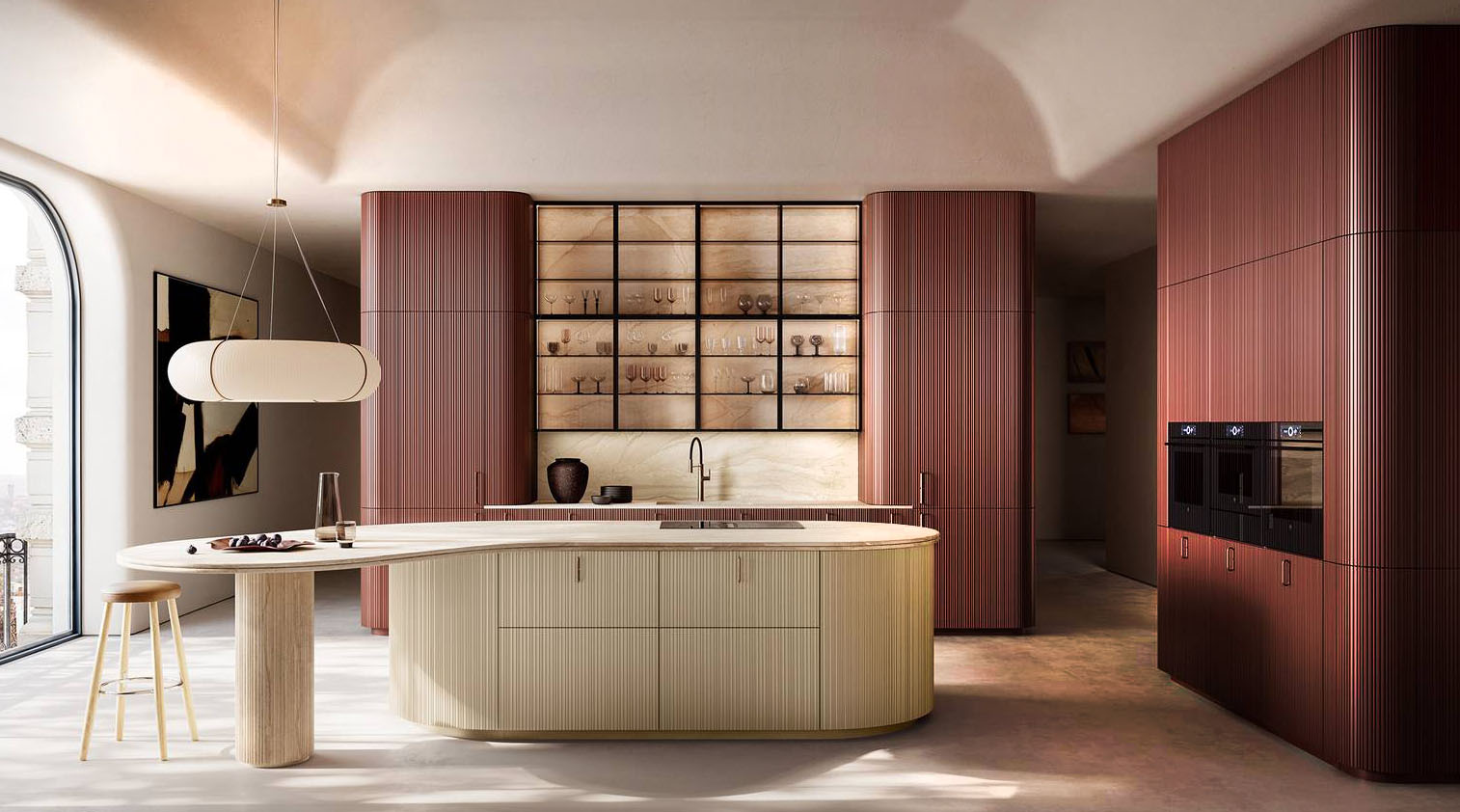 Un nuovo sviluppo per il modello Tangram di Cesar grazie al modulo aggiuntivo, un’evoluzione progettuale che supera il perimetro dell’isola. Le superfici diventano elemento di ricerca e vengono plasmate attraverso curve a raggio variabile, talvolta accostate a curve a raggio fisso, che danno vita a geometrie organiche e imprevedibili. L’isola in Laccato Seta ha il piano in marmo Breccia Sarda, crea un contrasto armonioso con la struttura verticale. Le colonne sono realizzate in Laccato Anodyc Rosso Jaipur, con anta Groove, decorata da una sequenza di fresature verticali dal ritmo irregolare che attenua la percezione degli accostamenti tra i moduli e restituisce un’immagine continua dell’insieme. https://www.cesar.it - Fuorisalone, Cesar Flagship Store – Via Larga 23, Milano.