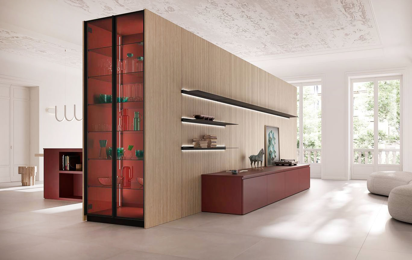 La cucina con isola del programma I Naturali di Ar-Tre ha le ante delle basi lisce declinate nella scenografica finitura opaca Lab Granata coordinate con quelle del mobile basso che arreda la zona giorno; il top è in Fenix rosso Jaipur. La struttura a colonne nella finitura Wave Mid, che accoglie la cucina lineare, funge da elemento separatore tra la zona operativa e il living. Prezzo su richiesta. https://www.ar-tre.it/it