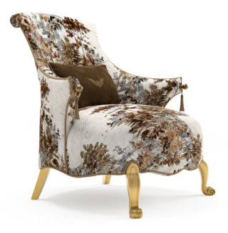 La poltrona Rivoli di Jumbo Collection mixa eleganza classica e suggestioni orientali: le gambe in legno intagliato hanno una finitura in oro patinato e la seduta sagomata è rivestita da un tessuto dai toni neutri con un disegno naturalistico e un piping a contrasto. I braccioli sono decorati da un pomello dorato e una nappina.  https://jumbocollection.com - Salone del mobile 2026, padiglione 13, Stand C09.