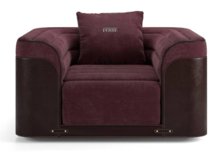 La poltrona Walen di Gianfranco Ferré Home è caratterizzata da una forma scultorea sottolineata dall'imbottitura con un classico motivo a righe e da un rivestimento in cuoio impreziosito da cinturini e bottoni.  https://gianfrancoferrehome.com - Salone del mobile 2026, padiglione 13, Stand C03.