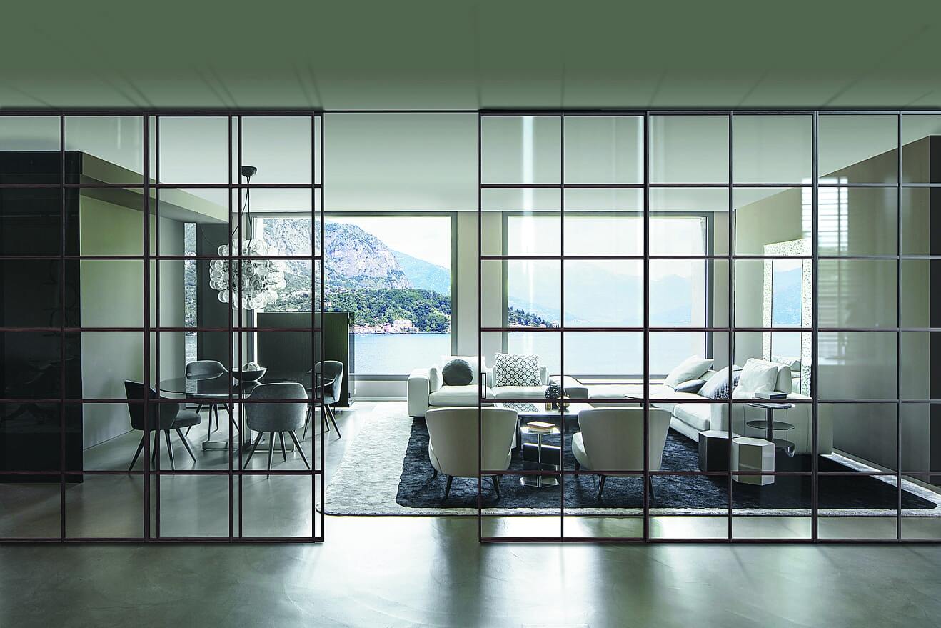 Il divisorio scorrevole Bellagio Mosaico di VIVA Porte
ha i profili in alluminio laccato color Lava che, per un effetto più classico, possono essere rivestiti anche con impiallacciatura in legno, disponibile nelle finiture rovere scuro, rovere chiaro e noce Canaletto. Inoltre, si possono inserire specchiature cieche in rovere o marmo, per giocare con l'alternanza trasparenza/opacità, e di conseguenza calibrare il grado di schermatura e di privacy desiderate. www.vivaporte.com Il divisorio scorrevole Bellagio Mosaico di VIVA Porte
ha i profili in alluminio laccato color Lava che, per un effetto più classico, possono essere rivestiti anche con impiallacciatura in legno, disponibile nelle finiture rovere scuro, rovere chiaro e noce Canaletto. Inoltre, si possono inserire specchiature cieche in rovere o marmo, per giocare con l'alternanza trasparenza/opacità, e di conseguenza calibrare il grado di schermatura e di privacy desiderate. www.vivaporte.com
