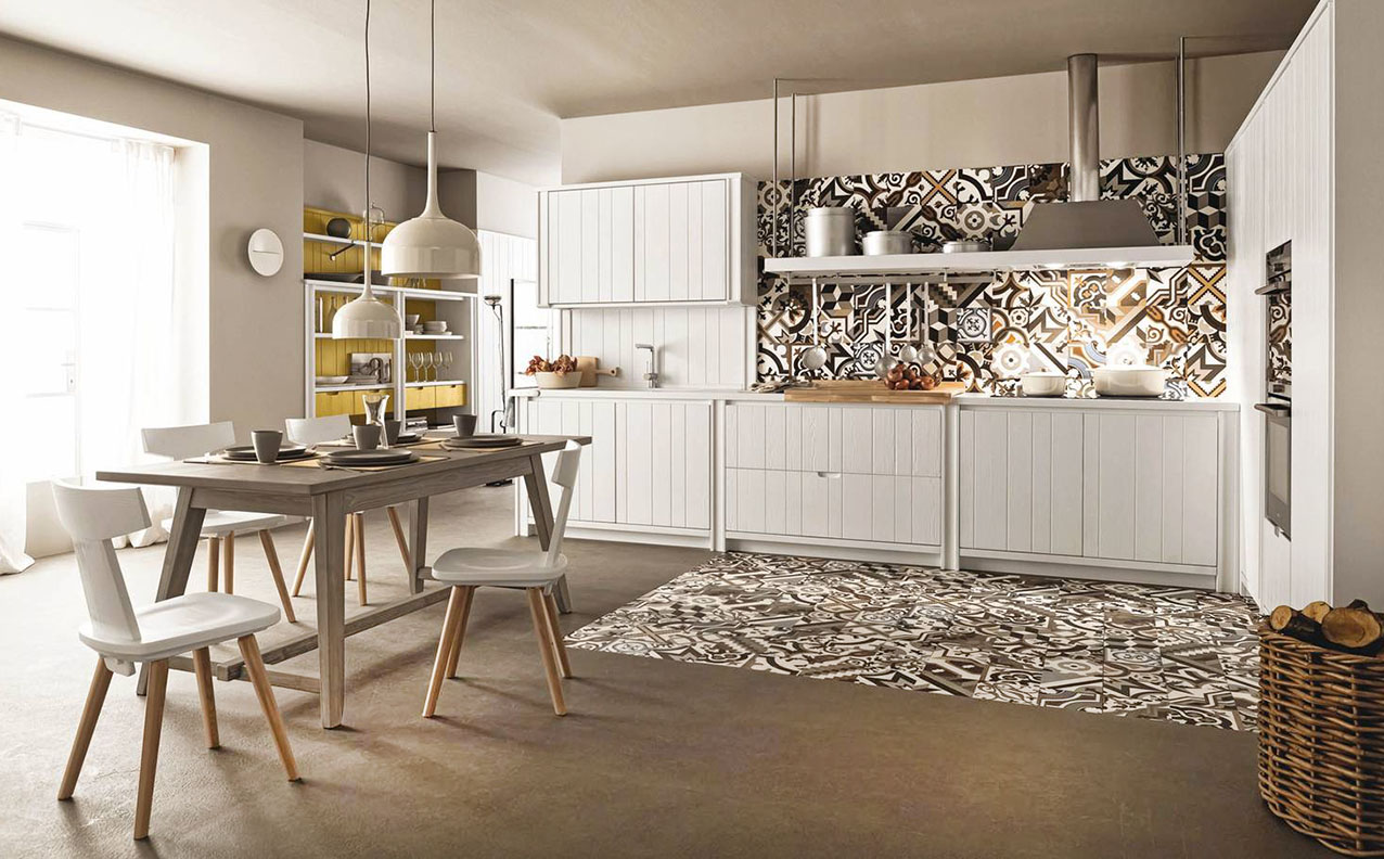 Sfrutta a pieno le pareti la cucina angolare M04 di Scandola Mobili che è caratterizzata dagli arredi con frontali dogati nella finitura Bianco Gesso, con boiserie e cassetti Curry; la cappa sospesa e il top sono realizzati in Hanex. L'ampia composizione bianca unisce il rigore dello stile moderno e l’utilizzo di materiali della tradizione come il legno. Un modulo base da 60 cm con un'anta, prezzo 493 euro + IVA. https://scandolamobili.it