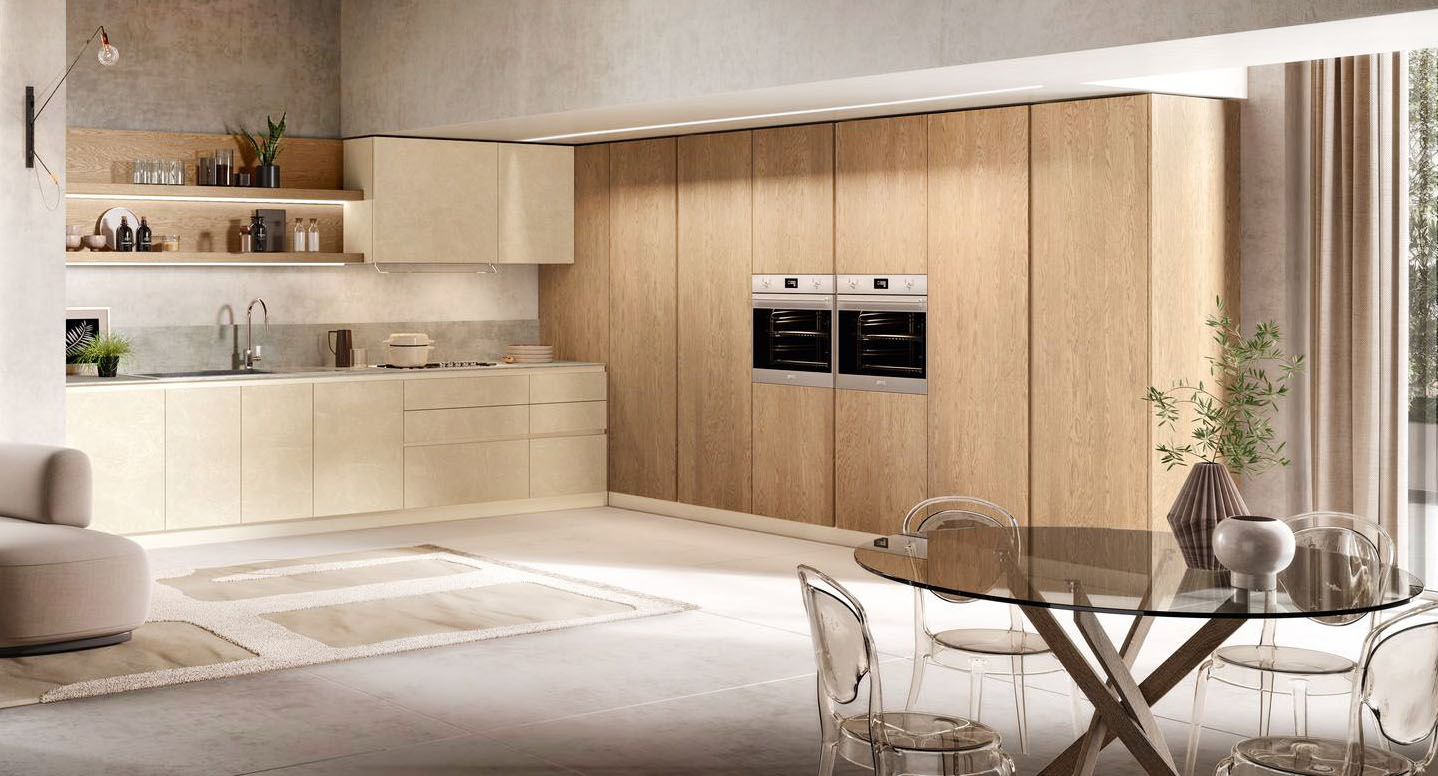 La cucina angolare Venere di Moretti Compact Cucine è composta da una zona operativa con una serie di basi e pensili con le ante in Laccato Malta écru e dall'armadiatura a colonne attrezzate a tutta altezza in Impiallacciato Rovere Biondo che rendono l'ambiente arioso e luminoso. L'estetica essenziale è sottolineata dall'apertura a gola laccata delle ante lisce. Prezzo su richiesta. https://www.moretticompact.it