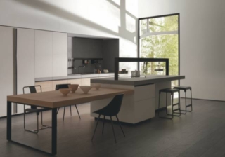 L'imponente tavolo snack Connexus nella finitura Olmo Tattile, collegato lateralmente all'isola, domina la cucina Genius Loci di Valcucine che è caratterizzata dal cassetto sottotop che dematerializza il piano di lavoro in Tech Ceramica. L’isola è arricchita dall’Elemento Speciale Ponte Attrezzato che divide l’ambiente senza chiuderlo, permettendo l’interazione fra l'area operativa e la zona giorno: è disponibile in due altezze e personalizzabile in base alle diverse esigenze. Prezzo su richiesta. https://www.valcucine.com L'imponente tavolo snack Connexus nella finitura Olmo Tattile, collegato lateralmente all'isola, domina la cucina Genius Loci di Valcucine che è caratterizzata dal cassetto sottotop che dematerializza il piano di lavoro in Tech Ceramica. L’isola è arricchita dall’Elemento Speciale Ponte Attrezzato che divide l’ambiente senza chiuderlo, permettendo l’interazione fra l'area operativa e la zona giorno: è disponibile in due altezze e personalizzabile in base alle diverse esigenze. Prezzo su richiesta. https://www.valcucine.com