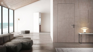 Porte "nascoste" nella parete: da sinistra, porta con telaio Filum (in fondo) e (in primo piano) porta blindata Sleek e sportello di ispezione Shape con rivestimenti uniformi alla parete. Porte "nascoste" nella parete: da sinistra, porta con telaio Filum (in fondo) e (in primo piano) porta blindata Sleek e sportello di ispezione Shape con rivestimenti uniformi alla parete.