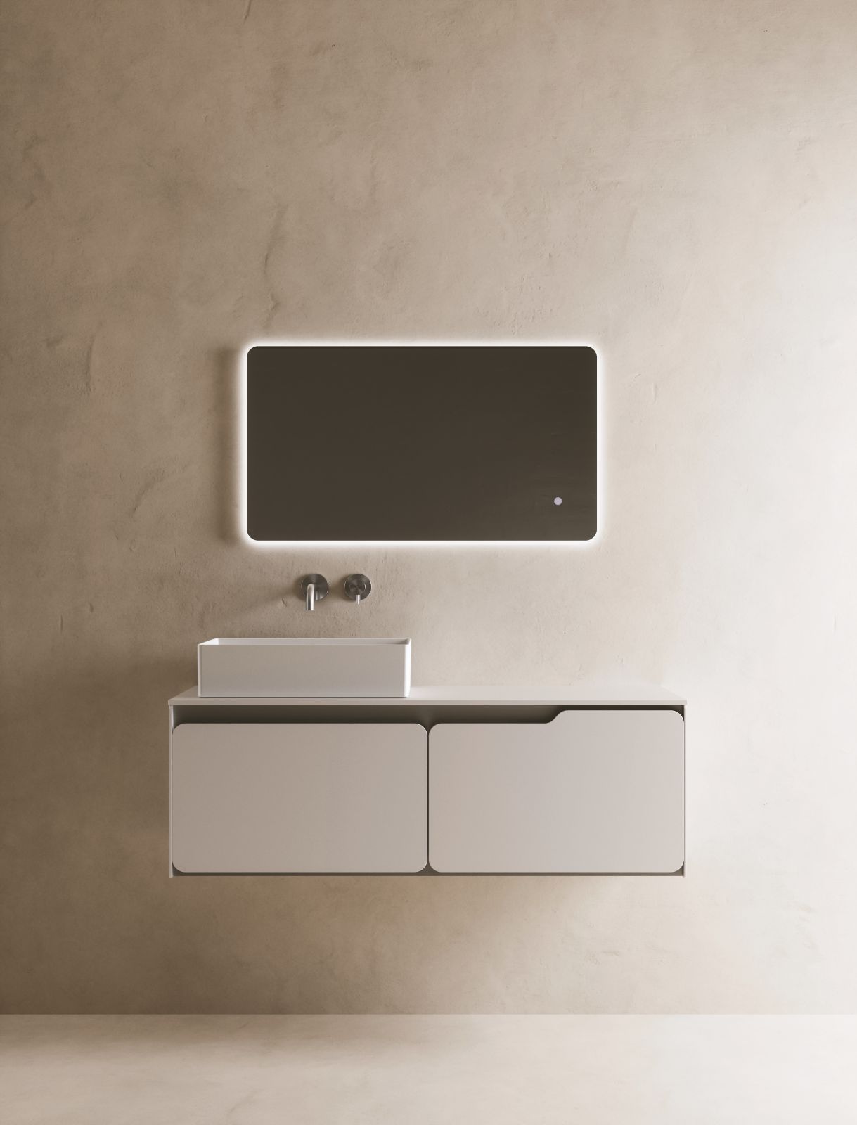 È rivestito completamente in solid surface bianco il mobile lavabo sospeso Solido di SDR con lavabo in appoggio. Anche il top è in solid surface e misura 1,2 cm. Misura L 120 x P 46 cm. Prezzo, comprensivo di top, 2.524 euro. https://sdrceramiche.it/