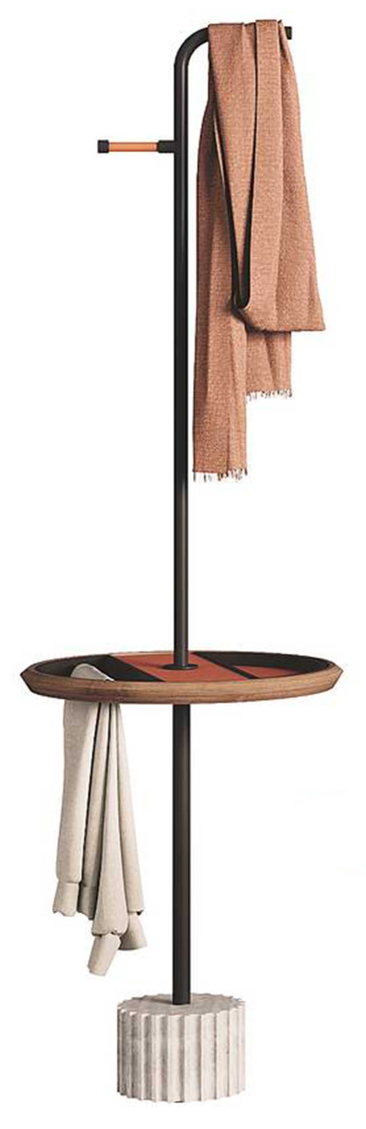 Tavolino e servomuto, Roma di Kico  ha la base in travertino e il piano in noce canaletto e cuoio. Misura Ø 45 x H 150,5 cm. Costa 1.719 euro. www.kico.it