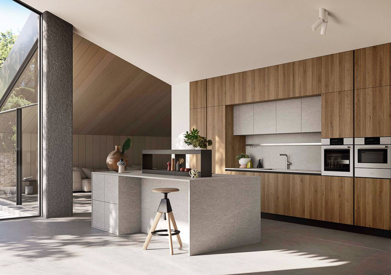 Nella cucina Up Design di Ar-Tre la zona lavaggio è posizionata in un'ampia nicchia tra le colonne e i pensili con le ante in melaminico effetto legno con venatura a vista. L'isola, dalla forma squadrata nella finitura pietra grigia, ospita il piano cottura e un pratico bancone snack. Prezzo su richiesta. https://www.ar-tre.it