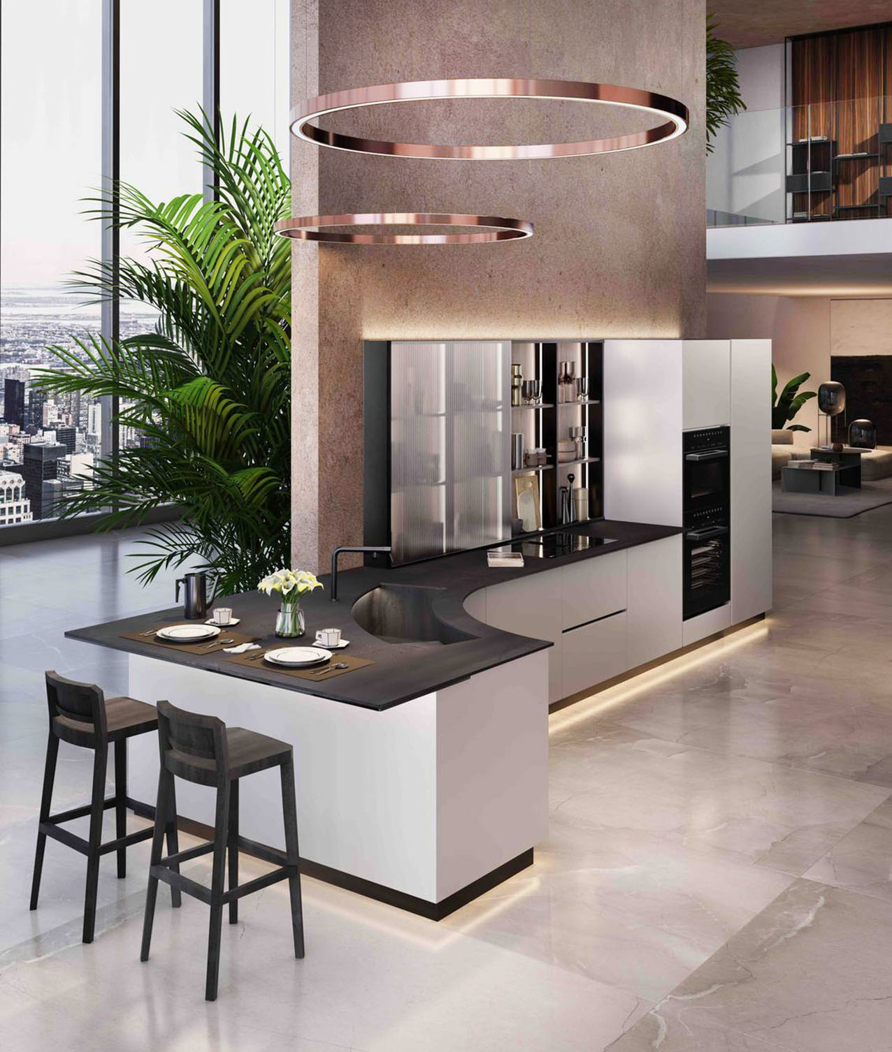 Nella composizione Virgola di ARAN Cucine, che si apre sulla zona giorno, è presente una  penisola dalla forma curva, ergonomica, dotata di un pratico bancone snack. La struttura, priva di interruzioni e spigoli, accompagna il movimento naturale del corpo nello spazio, rendendo ogni gesto quotidiano immediato e privo di attriti. Superfici in grès porcellanato ad alte prestazioni, legni certificati FSC® e vernici a base d’acqua contribuiscono a creare un ambiente durevole, sostenibile e attento alla qualità dell’aria. Prezzo su richiesta. https://www.arancucine.it