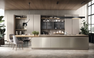 É dominata dalla presenza di un'ampia isola centrale, con piano di lavoro in Laminam Fokos Roccia dallo spessore maggiorato e lavello integrato abbinato alle ante delle basi in laccato metallizzato Nichel, la composizione Venere di Moretti Compact Cucine. Il tavolo a sbalzo ha il top in laminato HPL olmo mercurio e la gamba in vetro temprato finitura Fumé. La libreria Virgo trova posto tra le colonne con anta battente; i pensili con ante vetrina hanno telaio Kosmos metal gray e vetro fumè. Un pensile con anta telaio in alluminio e vetro Fumé, con presa maniglia integrata, prezzo a partire da 404 euro + Iva. https://www.moretticompact.it É dominata dalla presenza di un'ampia isola centrale, con piano di lavoro in Laminam Fokos Roccia dallo spessore maggiorato e lavello integrato abbinato alle ante delle basi in laccato metallizzato Nichel, la composizione Venere di Moretti Compact Cucine. Il tavolo a sbalzo ha il top in laminato HPL olmo mercurio e la gamba in vetro temprato finitura Fumé. La libreria Virgo trova posto tra le colonne con anta battente; i pensili con ante vetrina hanno telaio Kosmos metal gray e vetro fumè. Un pensile con anta telaio in alluminio e vetro Fumé, con presa maniglia integrata, prezzo a partire da 404 euro + Iva. https://www.moretticompact.it